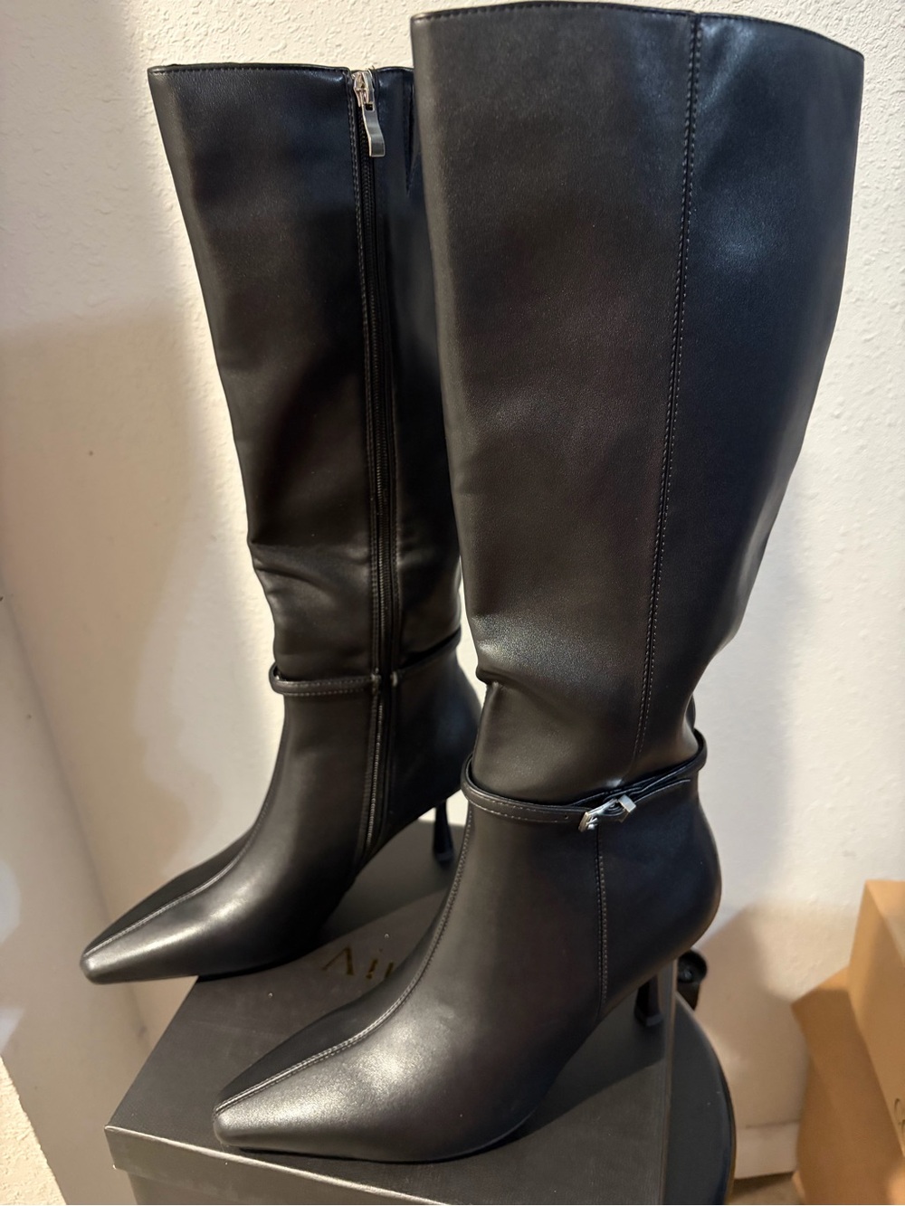Sleek Black Pointed-Toe Knee-High Heeled Boots